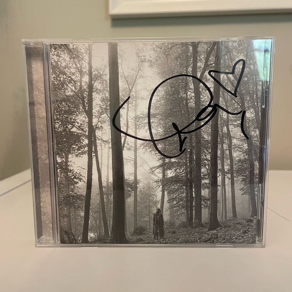 Signed Taylor Swift Folklore CD with heart and sharpie smudge